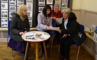 Members of Farnhill and Kildwick Local History Group selecting items for the archive exhibition