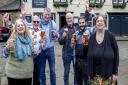 Quiz league members raise a glass to Timothy Taylor's