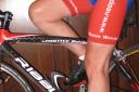 The heel of the left foot is on pedal and leg extended. When foot is cleated in properly, the leg moves easily with no sliding on the saddle