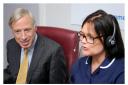 Earl Howe using the secure video link in the Telehealth Hub at Airedale Hospital to speak to a patient, accompanied by telehealth sister Alex Blake