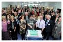 From left at the front, former patients Gareth Scott and Martin Quirk cut a celebratory cake at the preview launch of Airedale's new Emergency Department