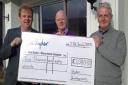 Sue Ryder fundraiser Andrew Wood, left, receives a cheque from Dennis Horne, centre, and Kevin Bell