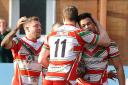 Cougars celebrations as Charlie Martin scores a try in the victory over Oldham