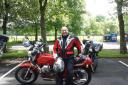 Retired firefighter Giovanni Richetta with his treasured Moto Guzzi