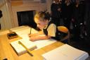 A pupil of Haworth Primary School helping write the new manuscript for Emily Brontë’s Wuthering Heights