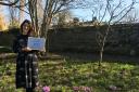 Emily Taylor, volunteer and community involvement manager at East Riddlesden Hall, in the hall’s garden with the award from Dementia Friendly Keighley