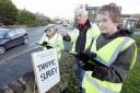 Parish councillors carry out a survey of vehicles  in the area as part of their efforts to stop the scheme