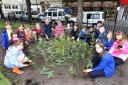 l Flashback: Steve Thorpe with pupils from Haworth, Parkwood and Stanbury Primary Schools in a gardening session in Keighley Town Hall Square