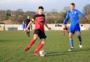 The dismissal of Arley Barnes (in red) changed the whole complexion of Silsden's home game against Hallam last night. Picture: Linda Gartland.
