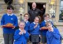Lothersdale Primary School pupils enjoy some onion rings outside the Hare and Hounds