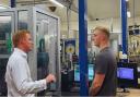 MP Robbie Moore chats to a worker during his visit to Keighley Laboratories