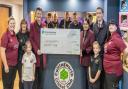 Cullingworth Cricket Club receives the cheque from Persimmon