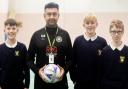 Student mentor and teaching assistant Chinny Singh with the pupils