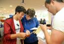 James Figg, left, Adam Beazley and James Meehan, right, check their results at South Craven School