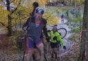 Bronte Wheelers member Kevin Hickie running up a hill with his bike slung over his shoulder during a cyclo-cross race