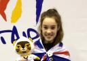 Leah Moorby shows off her Junior World Championship bronze medal and memento