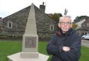 Parish Councilor Patrick Hargreaves views the newly installed Cross Hills and Glusburn War Memorial. (11422352)