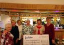 Ladies 2000 committee members with their cheque for Manorlands