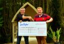 Keighley Gala chairman Andrew Jackson, left, presents a cheque to Manorlands fundraiser Andrew Wood