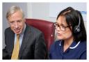 Earl Howe using the secure video link in the Telehealth Hub at Airedale Hospital to speak to a patient, accompanied by telehealth sister Alex Blake