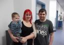 Former emergency department patient Gareth Scott, right, with his partner Phillipa Hall and their son Bobby Scott-Hall