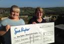 Kath Neal and daughter Jenny with their cheque for Manorlands