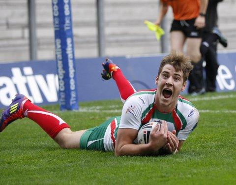 Danny Lawton celebrates scoring Cougars' first try