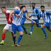 Eccleshill's Jonny Irving (blue and white) and Thackley's Loz Hunter (red) duel for a header in a previous clash between the two Bradford rivals. Picture: Richard Leach.