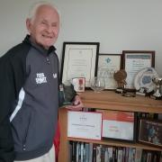 Hans with some of his awards, the British Empire Medal award taking pride of place