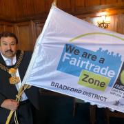 Lord Mayor of Bradford, Cllr Shabir Hussain, with the Fairtrade zone flag