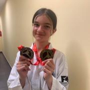 Yvie Ling Hegarty with her medals that she won in Poland.