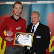 Haworth Hawks’ Andy Bray receives his award from ETTA treasurer Martin Clark