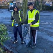 Picking up litter in the town centre