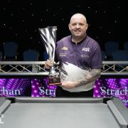 Chris Melling with his Pro Series trophy on Sunday night, with the victory making him world number one. Picture: Ultimate Pool.