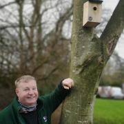 Acorn Stairlifts groundsman Andrew Stirk with one of the nesting boxes