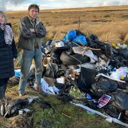 Councillor Rebecca Poulsen and farmer Walter Clay, with some of the rubbish dumped on his land