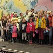 The group of Ukrainian refugees on stage with the panto cast