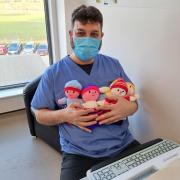 Muhammed Idrees, Senior Pharmacy Technician at Airedale NHS Foundation Trust with some of the soft dolls that have previously been donated