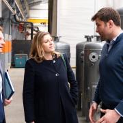 Penny Mordaunt, accompanied by Keighley MP Robbie Moore, in conversation during her tour of Byworth Boilers