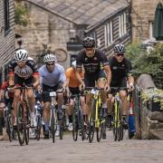 Cyclists take on Haworth Main Street in a previous Bronte Sportive