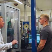 MP Robbie Moore chats to a worker during his visit to Keighley Laboratories