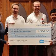 Aaron and Nathan Berry, their mum Nancy and Zamir Hanif with the cheque for Manorlands