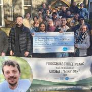 Family and friends of Michael present a cheque to Manorlands