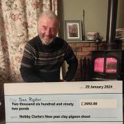 Nobby Clarke with his latest cheque for Manorlands