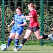 Action from the Lower Hopton Devs v. Field match in the WRCWFL Shield,  featuring Field's Player-of-the-match Megan Howell (in blue).   Pic courtesy of DG Photography/Danny Green