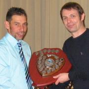 Matthew Cutler, right, receiving the fastest open 25-mile time trial shield, being presented by professional cyclist Chris Young