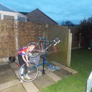 Isabelle Green changing an inner tube to mend a puncture on her bike