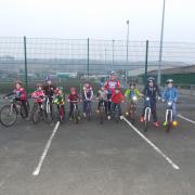 Young cyclists, from left, Harry Ellinson, Noah Ellinson, Owen Thompson, Archie, Jamie Wilson, Isabelle Green, Kyle Wilson, Peter Charlton, Conner Costello, Harry Rhoades, Ben Halfpenney and Devon Costello saddle up for the Go-Ride kids club