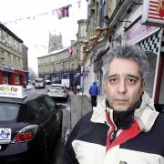 Restaurant owner Al Mirzaali outside his businesses in Church Street, Keighley
