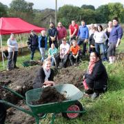Volunteers, including staff from United Kingdom Asset Resolution in Crossflatts, at work in the North Dean Road allotment (11268643)